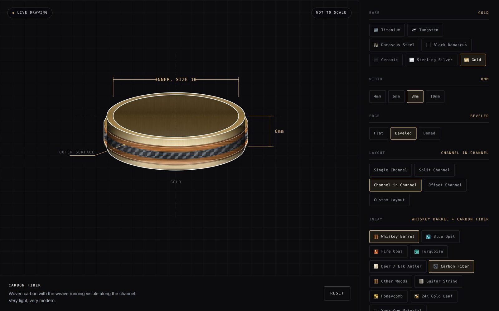 The ring builder with a gold band drawn on screen: whiskey barrel wood in the channel and a stripe of carbon fibre set through the middle of it, with the base, width, layout and inlay controls beside it.